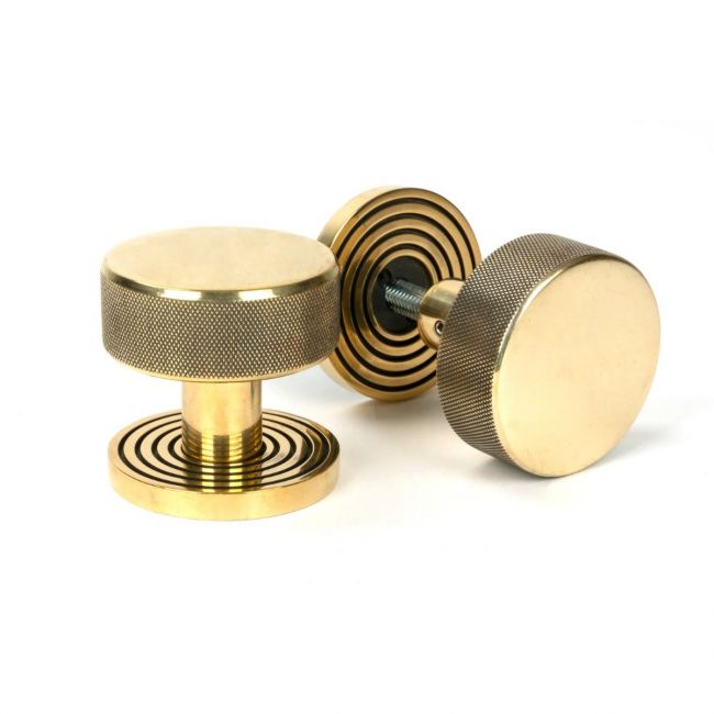 The Aged Brass Knurled Mortice/Rim Knob Set on a Beehive Rose Shown Upright and on its Side The Aged Brass Knurled Mortice/Rim Knob Set on a Beehive Rose Shown Upright and on its Side