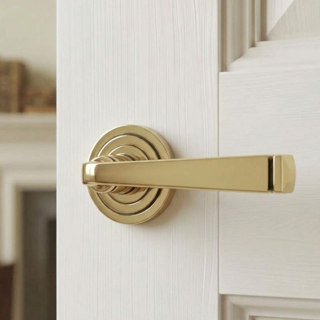 The Aged Brass Tapered Lever on Art Deco Rose Set on a White Background 