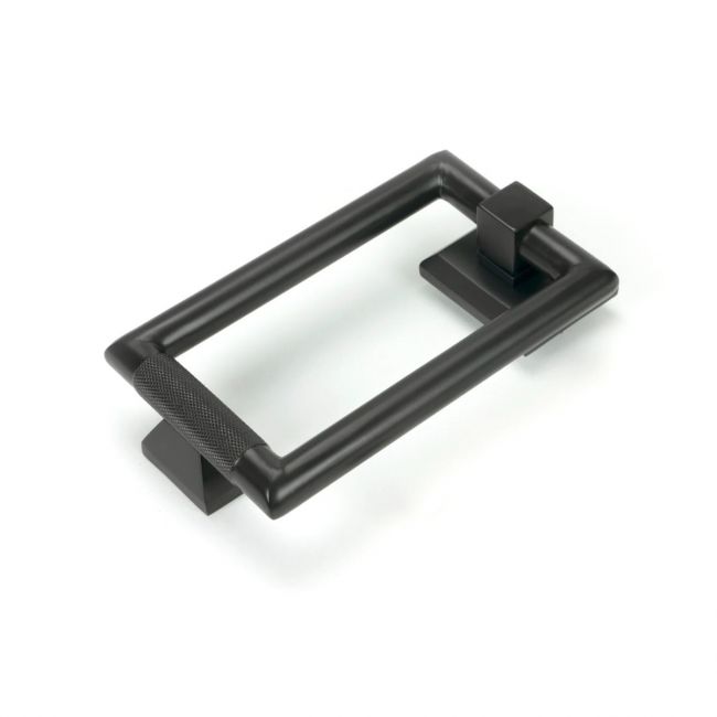The Aged Bronze Modern Knurled Rectangular Door Knocker on a White Background The Aged Bronze Modern Knurled Rectangular Door Knocker on a White Background