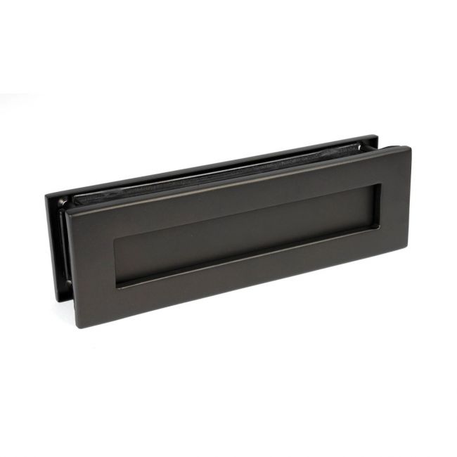 The Aged Bronze Traditional Sleeved Door Letterbox Set on a White Background The Aged Bronze Traditional Sleeved Door Letterbox Set on a White Background
