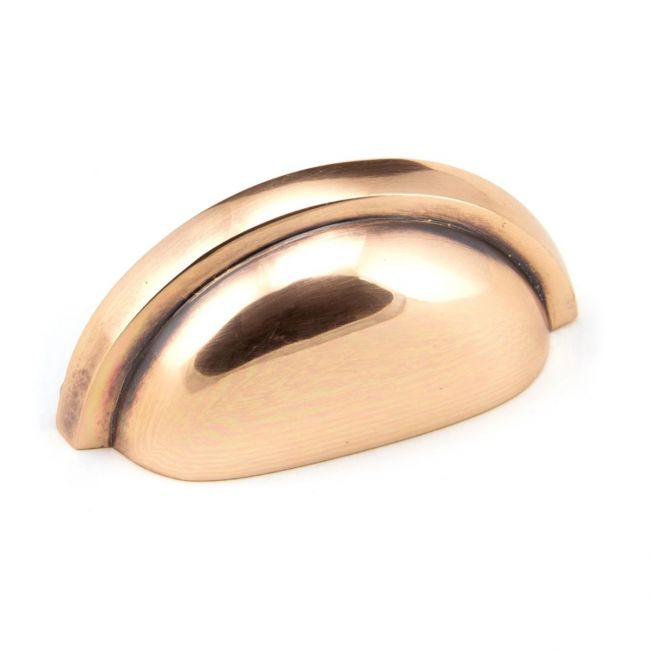 The Art Deco Concealed Cup Drawer Pull in Polished Bronze on a White Background The Art Deco Concealed Cup Drawer Pull in Polished Bronze on a White Background