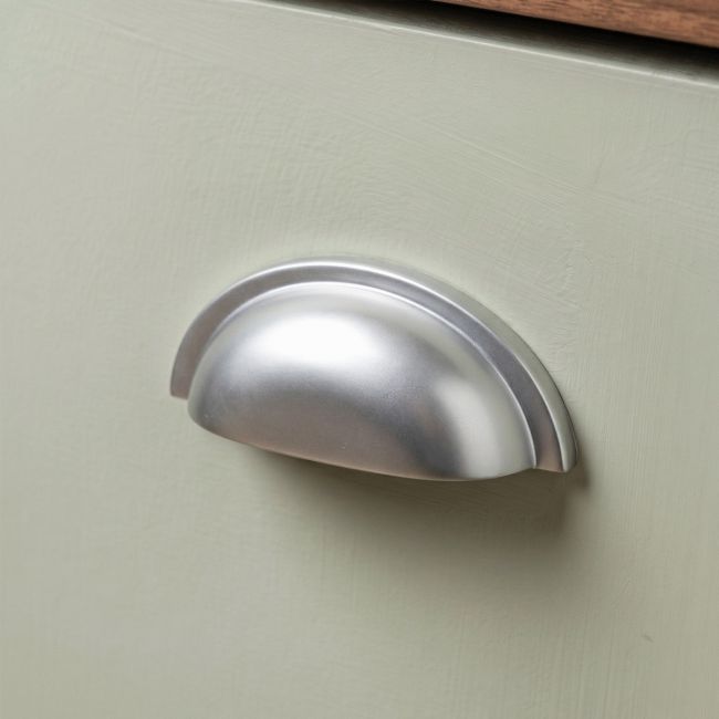 The Art Deco Concealed Cup Drawer Pull in Satin Chrome on a White Background 