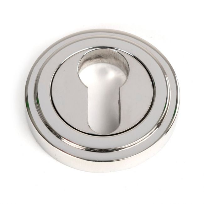 The Art Deco Concealed Euro Keyhole Escutcheon in Polished Stainless Steel Shown on a White Background