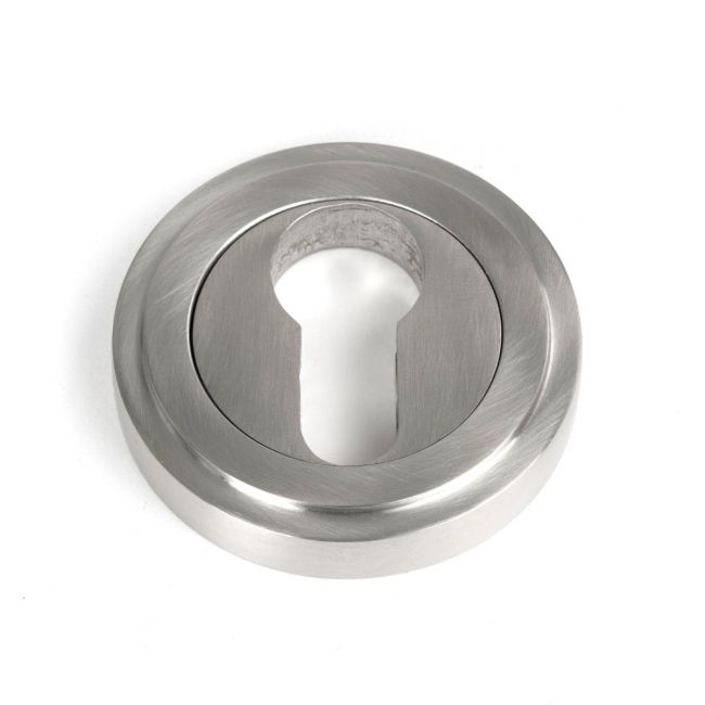 The Art Deco Concealed Euro Keyhole Escutcheon in Satin Stainless Steel Shown on a White Background