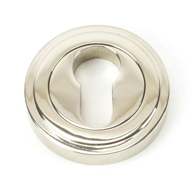 The Art Deco Concealed Standard Euro Escutcheon - Polished Nickel on a White Background The Art Deco Concealed Standard Euro Escutcheon - Polished Nickel on a White Background