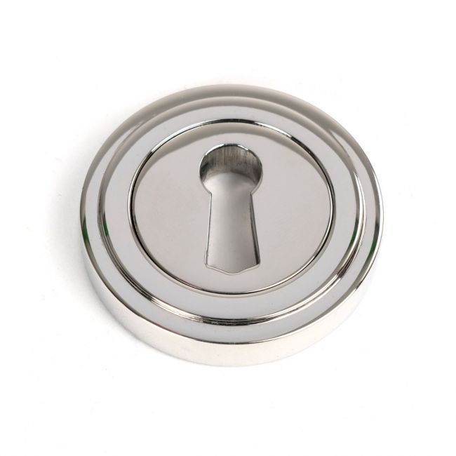 The Art Deco Concealed Standard Keyhole Escutcheon in Polished Stainless Steel Shown on a White Background