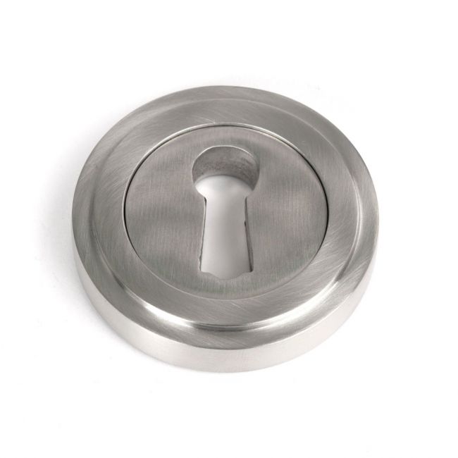 The Art Deco Concealed Standard Keyhole Escutcheon in Satin Stainless Steel Shown on a White Background