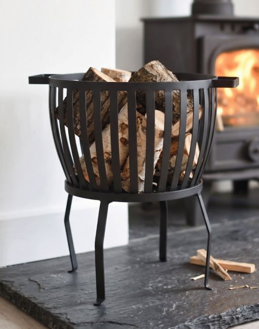 The "Barrow" Traditional Log Basket Filled with Logs Displayed to the side of a Log Burner Stove - Digital Illustration The "Barrow" Traditional Log Basket Filled with Logs Displayed to the side of a Log Burner Stove - Digital Illustration