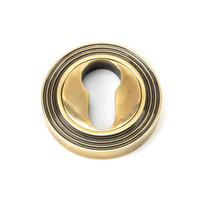 The Beehive Concealed Standard Euro Escutcheon - Aged Brass on a White Background The Beehive Concealed Standard Euro Escutcheon - Aged Brass on a White Background