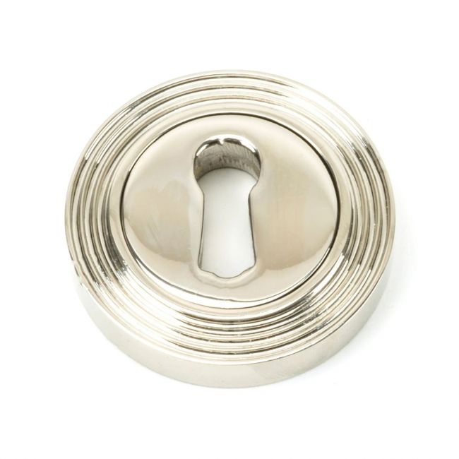 The Beehive Concealed Standard Keyhole Escutcheon - Polished Nickel on a White Background The Beehive Concealed Standard Keyhole Escutcheon - Polished Nickel on a White Background