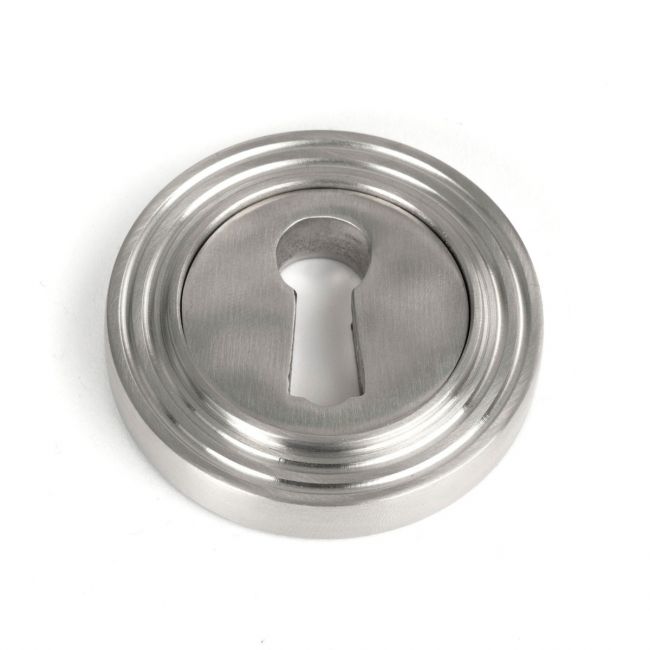 The Beehive Concealed Standard Keyhole Escutcheon in Satin Stainless Steel Shown on a White Background