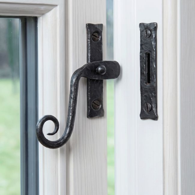 The Bees Wax Monkey Tail Window Fastener Fitted on a Classic White Painted Window Frame - Digital Illustration
