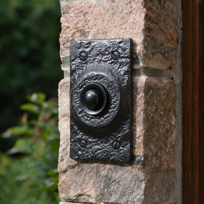 The Black Iron Square Bell Push on a Granite Stone Wall next to a House Front Entrance - Digital Illustration The Black Iron Square Bell Push on a Granite Stone Wall next to a House Front Entrance - Digital Illustration