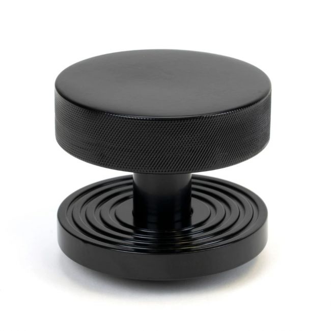 The Black Knurled Centre Door Knob on a Beehive Rose Shown Upright on a White Background The Black Knurled Centre Door Knob on a Beehive Rose Shown Upright on a White Background