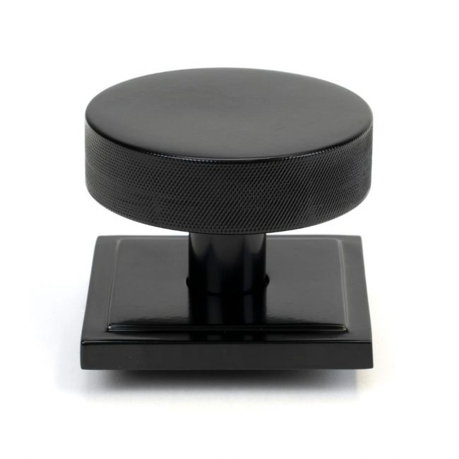 The Black Knurled Centre Door Knob on a Square Rose Shown Upright on a White Background The Black Knurled Centre Door Knob on a Square Rose Shown Upright on a White Background