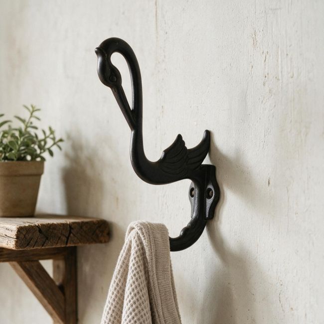 Swan Cast Iron Hooks in Situ on a Green Door Swan Cast Iron Hooks in Situ on a Green Door