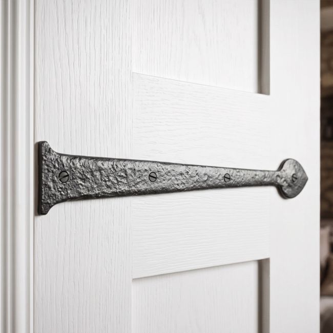 The Blacksmith Inspired Iron Hinge Front Fitted onto the Front of a Bright White Internal Door to Create a Traditional Look - Digital Illustration 