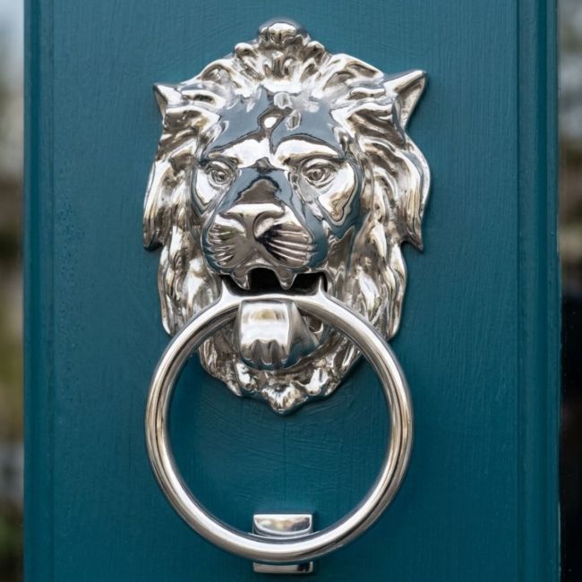 Bright Chrome Ascot Lion door knocker on grey door