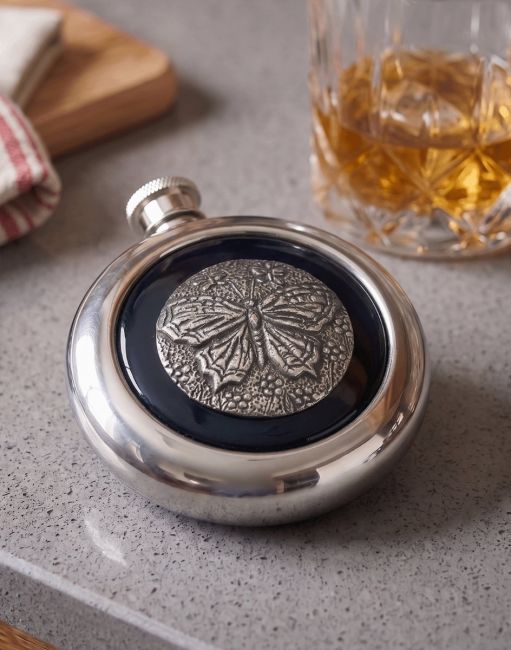 The Butterfly Whiskey Flask next to a Glass of Scoth on a Kitchen Counter - Digital Illustration The Butterfly Whiskey Flask next to a Glass of Scoth on a Kitchen Counter - Digital Illustration