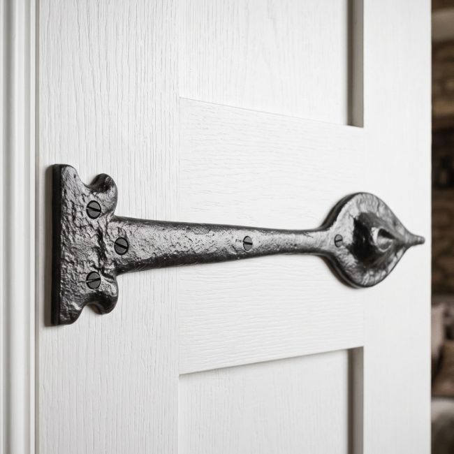 The Cast Iron Leaf Inspired Door Hinge Fitted onto a White Door to give a Traditional Feel - Digital Illustration 