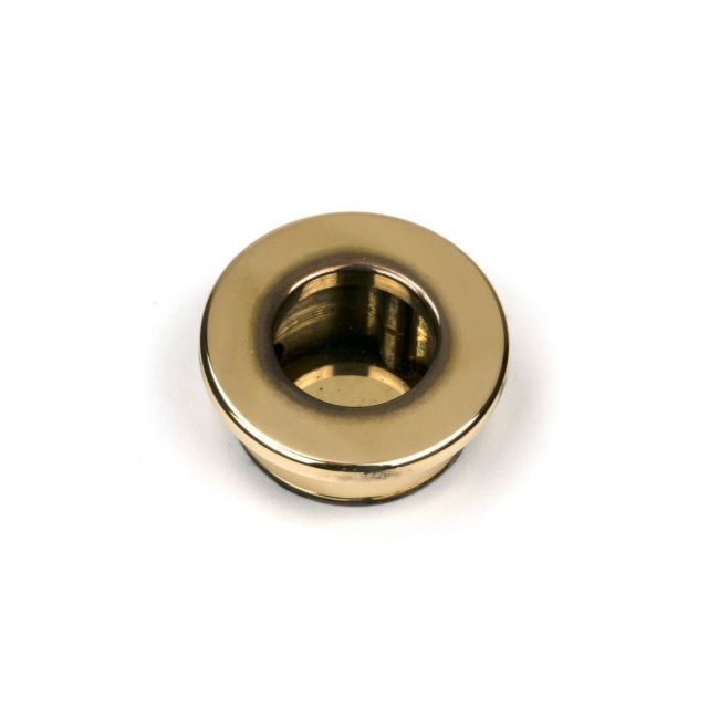 The Circular Pocket Door Edge Pull in Aged Brass Shown from the Front on a White Background