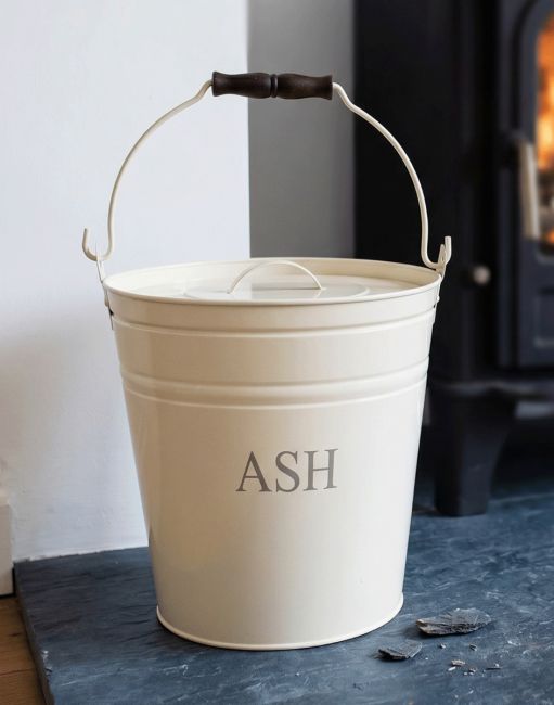 The Cream Contemporary Ash Bucket Placed next to a Log Burner Stove on a Black Stone Hearth - Digital Illustration The Cream Contemporary Ash Bucket Placed next to a Log Burner Stove on a Black Stone Hearth - Digital Illustration