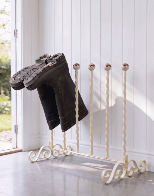 The Cream Grangewood 3 Pair Boot Rack Placed in a Contemporary Cottage Porch Entranceway - Digital Illustration The Cream Grangewood 3 Pair Boot Rack Placed in a Contemporary Cottage Porch Entranceway - Digital Illustration