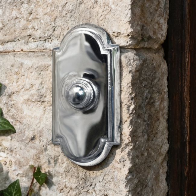 Arched Traditional Bright Chrome Door Bell on Brick Wall