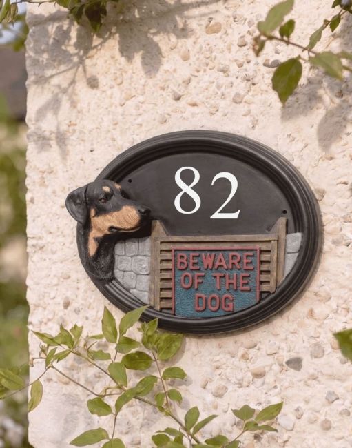 A Number 82 Doberman Hand Painted House Sign Mounted on a Pebble Cottage Wall - Digital Illustration A Number 82 Doberman Hand Painted House Sign Mounted on a Pebble Cottage Wall - Digital Illustration
