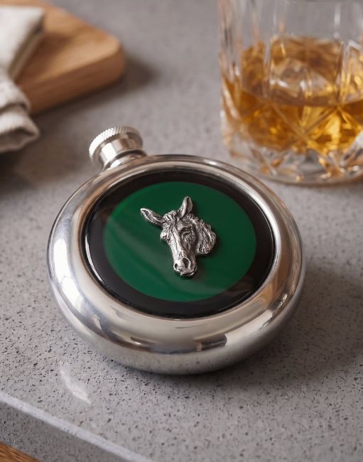 The Donkey Stainless Steel Whisky Flask with a Glass of Whiskey Next to it - Digital Illustration