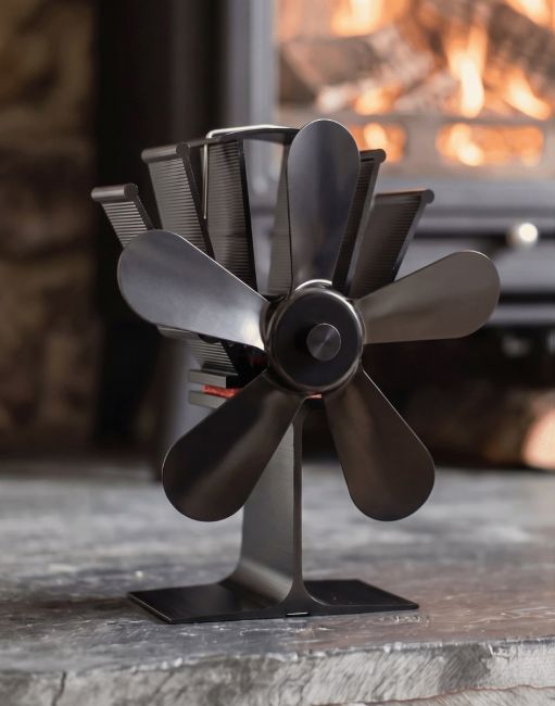 The Five Blade Heat Powered Stove Fan in Front of a Traditional Log Burner - Digital Illustration 