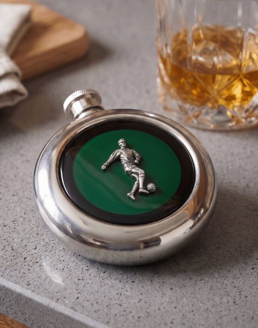 The Footballer Whiskey Flask on a grey Countertop next to a Glass of Scoth - Digital Illustration