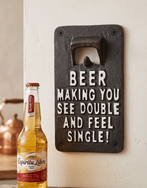The Funny Wall Mounted Iron Bottle Opener with the Message Beer making you see Double and Feel Single Mounted on a White Painted wall - Digital Illustration The Funny Wall Mounted Iron Bottle Opener with the Message Beer making you see Double and Feel Single Mounted on a White Painted wall - Digital Illustration