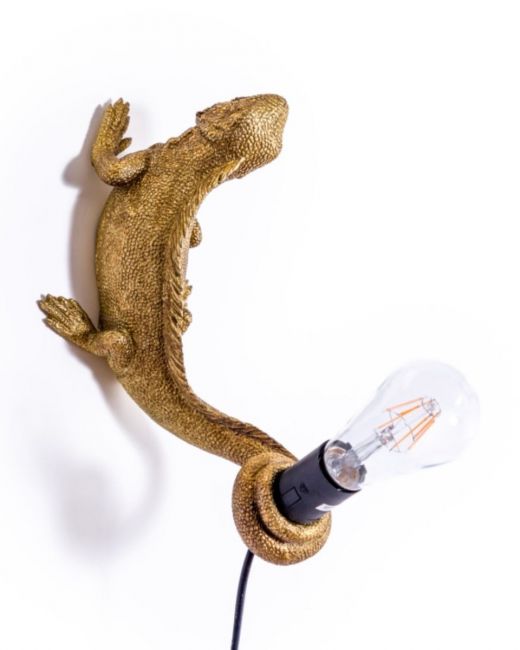The Gold "Arboreal Guardian" Iguana Wall Light Mounted on a White Wall