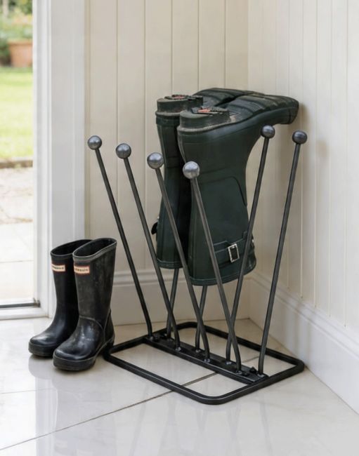 The High-Quality Metal 4 Pair Boot or Wellie Rack Placed On a Cream Coloured Tile Floor Cottage Porch Close up View - Digital Illustration The High-Quality Metal 4 Pair Boot or Wellie Rack Placed On a Cream Coloured Tile Floor Cottage Porch Close up View - Digital Illustration