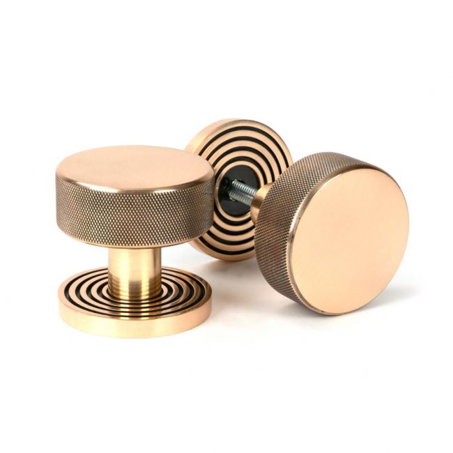 The Knurled Mortice/Rim Knob Set on a Beehive Rose in Polished Bronze Shown Upright and on its Side The Knurled Mortice/Rim Knob Set on a Beehive Rose in Polished Bronze Shown Upright and on its Side