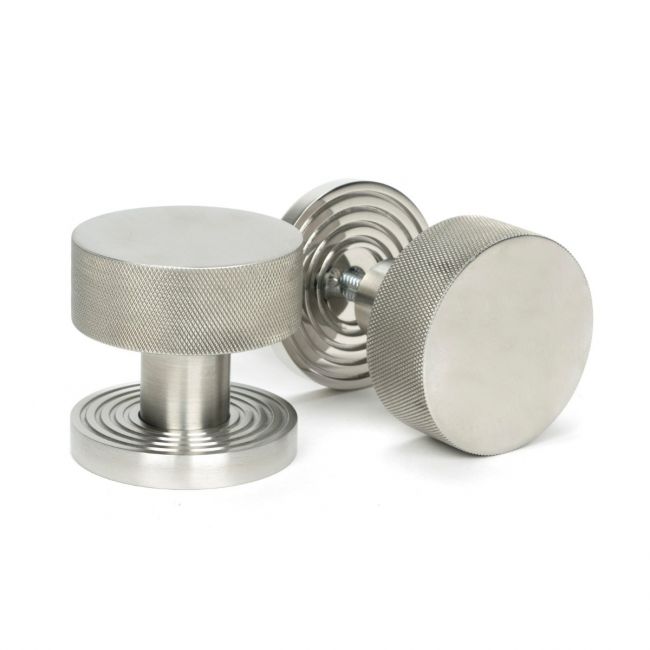 The Knurled Mortice/Rim Knob Set on a Beehive Rose in Satin Stainless Steel Shown Upright and on its Side The Knurled Mortice/Rim Knob Set on a Beehive Rose in Satin Stainless Steel Shown Upright and on its Side