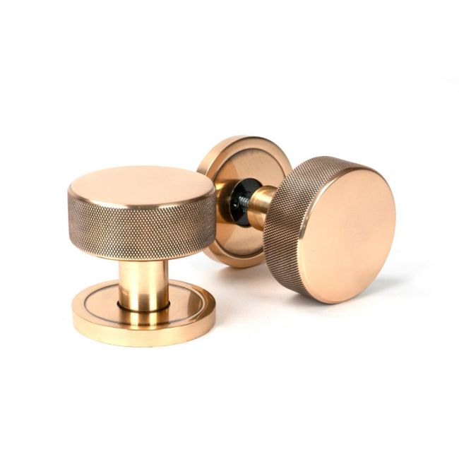 The Knurled Mortice/Rim Knob Set on a Plain Rose in Polished Bronze Shown Upright and on its Side The Knurled Mortice/Rim Knob Set on a Plain Rose in Polished Bronze Shown Upright and on its Side