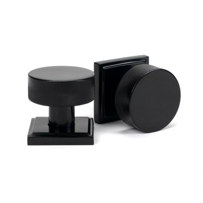 The Knurled Mortice/Rim Knob Set on a Square Rose in Black Shown Upright and on its Side The Knurled Mortice/Rim Knob Set on a Square Rose in Black Shown Upright and on its Side