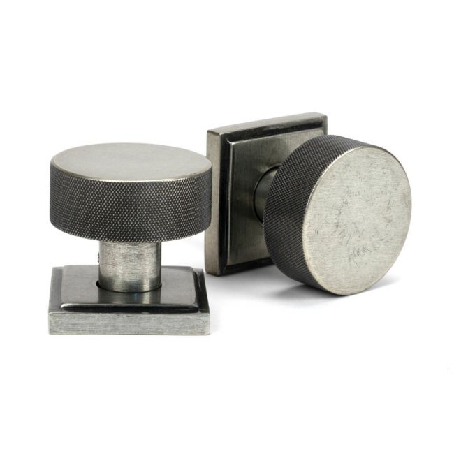 The Knurled Mortice/Rim Knob Set on a Square Rose in Pewter Shown Upright and on its Side The Knurled Mortice/Rim Knob Set on a Square Rose in Pewter Shown Upright and on its Side
