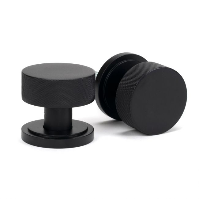 The Knurled Mortice/Rim Knob Set on an Art Deco Rose in Matt Black Shown Upright and on its Side The Knurled Mortice/Rim Knob Set on an Art Deco Rose in Matt Black Shown Upright and on its Side