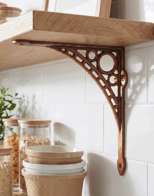 The Large 33 x 33cm "Ironbridge" Antique Copper Shelf Bracket Mounted on a Tile Kitchen wall in a Copper Finish - Digital Illustration 