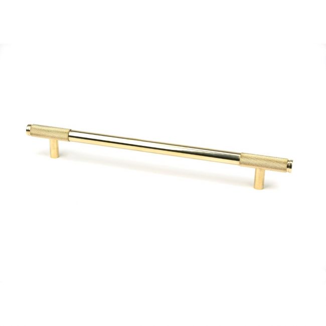 The Large Half Knurled Cabinet Pull Handle in Polished Brass Shown Upright on a White Background