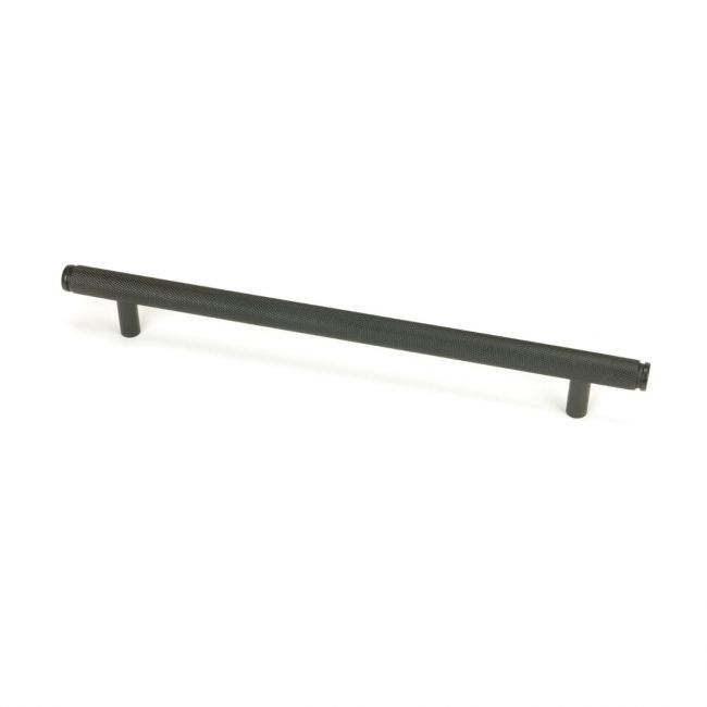 The Large Knurled Cabinet Pull Handle in Aged Bronze Shown Upright on a White Background