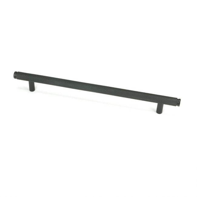 The Large Knurled Cabinet Pull Handle in Matt Black Shown Upright on a White Background The Large Knurled Cabinet Pull Handle in Matt Black Shown Upright on a White Background