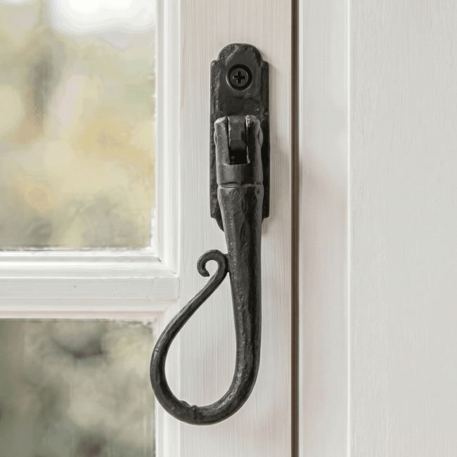 The Left Handed 20mm Beeswax Shepherd"s Crook Espagnolette Window Handle Fitted on a Traditional White Hand Painted Window Frame - Digital Illustration 