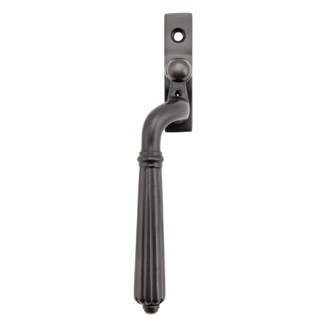 The Left Handed Aged Bronze Reeded Georgian Espagnolette Window Handle on a White Background on a White Background The Left Handed Aged Bronze Reeded Georgian Espagnolette Window Handle on a White Background on a White Background