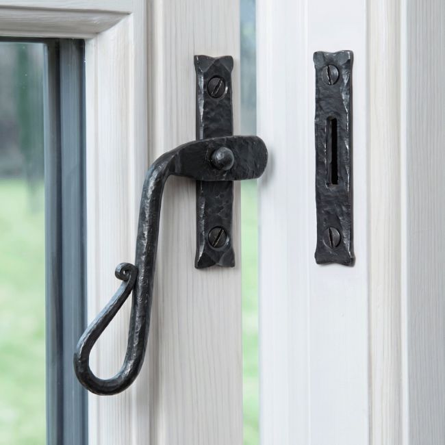 The Left Handed Bees Wax Shepherds Crook Window Fastener Mounted on a White Painted Window Frame Opened Position - Digital Illustration