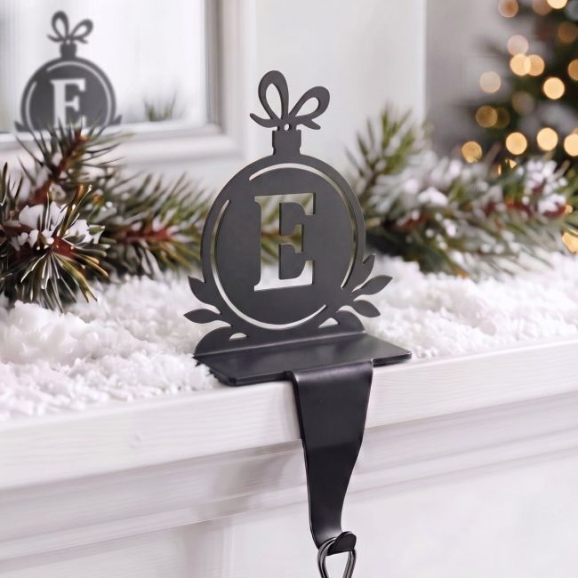 Letter E Stocking Holder in Situ on a Mantel Piece 