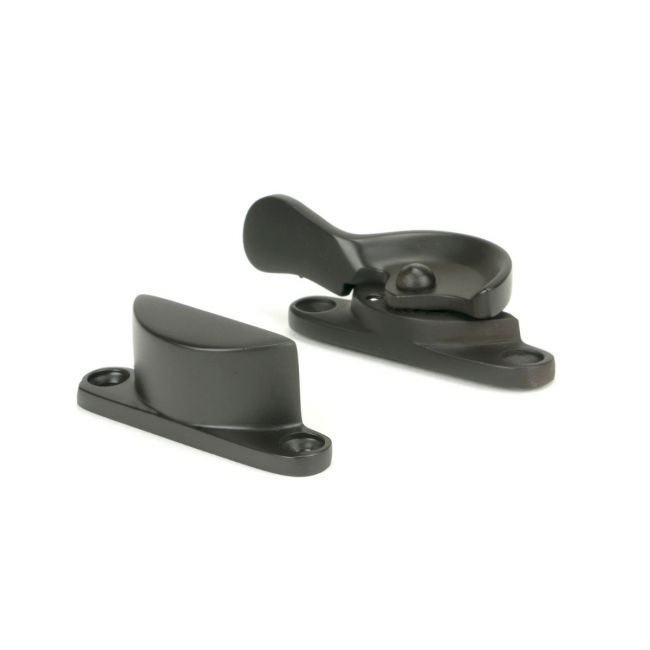 The Locking Fitch Sash Window Fastener - Aged Bronze on a White Background 